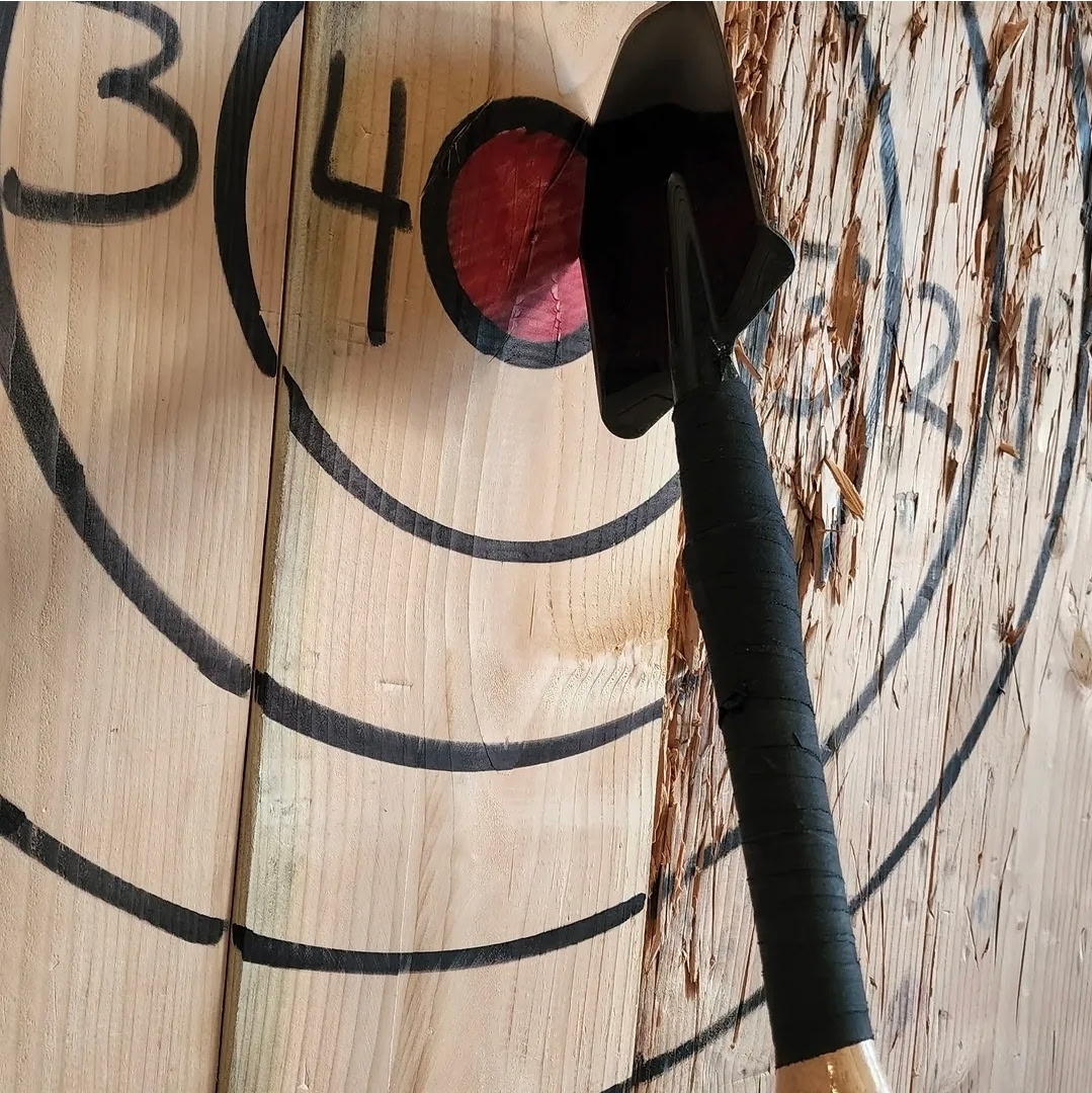 Axe stuck in target at State Street Axe Club